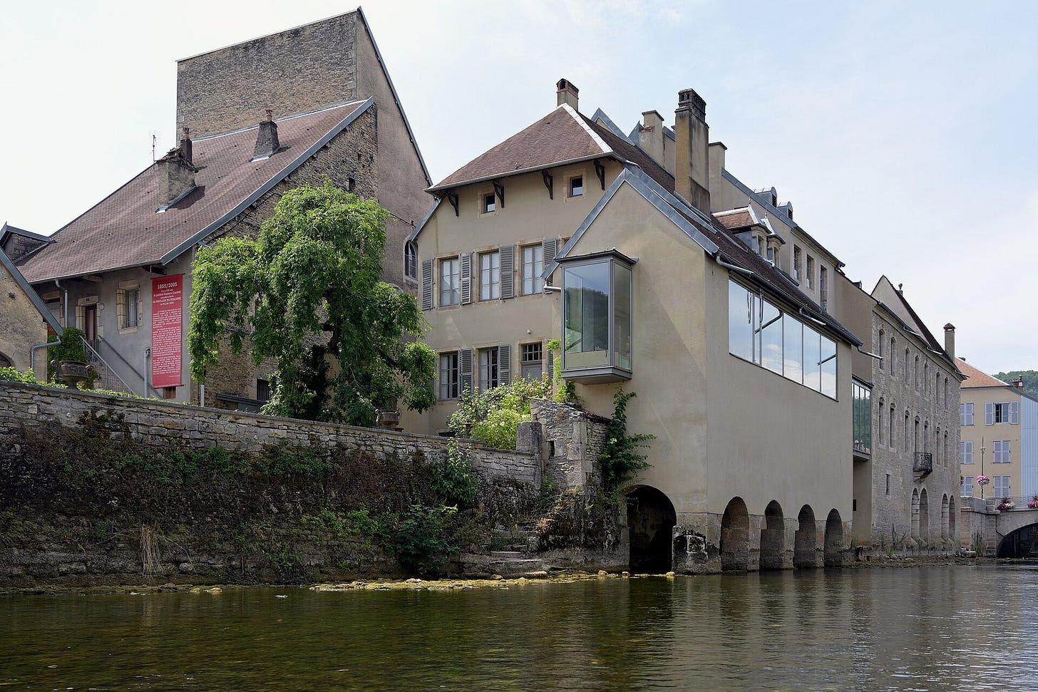 The Musée Courbet in Ornans, Courbet's hometown, seen from the Loue river. The Musée Courbet in Ornans, Courbet's hometown, seen from the Loue river.