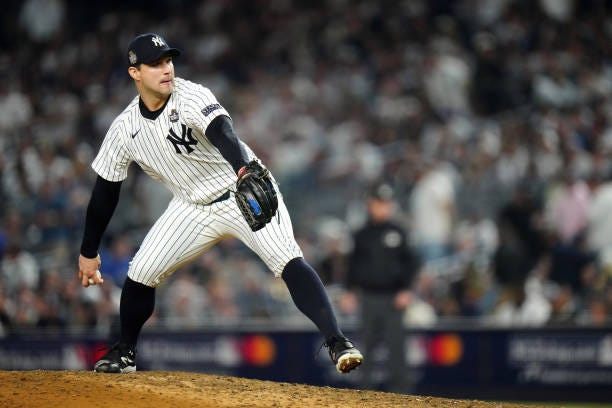 Tommy Kahnle of the New York Yankees pitches during Game 5 of the 2024 World Series presented by Capital One between the Los Angeles Dodgers and the...