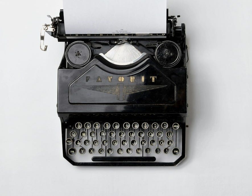 black Fayorit typewriter with printer paper black Fayorit typewriter with printer paper