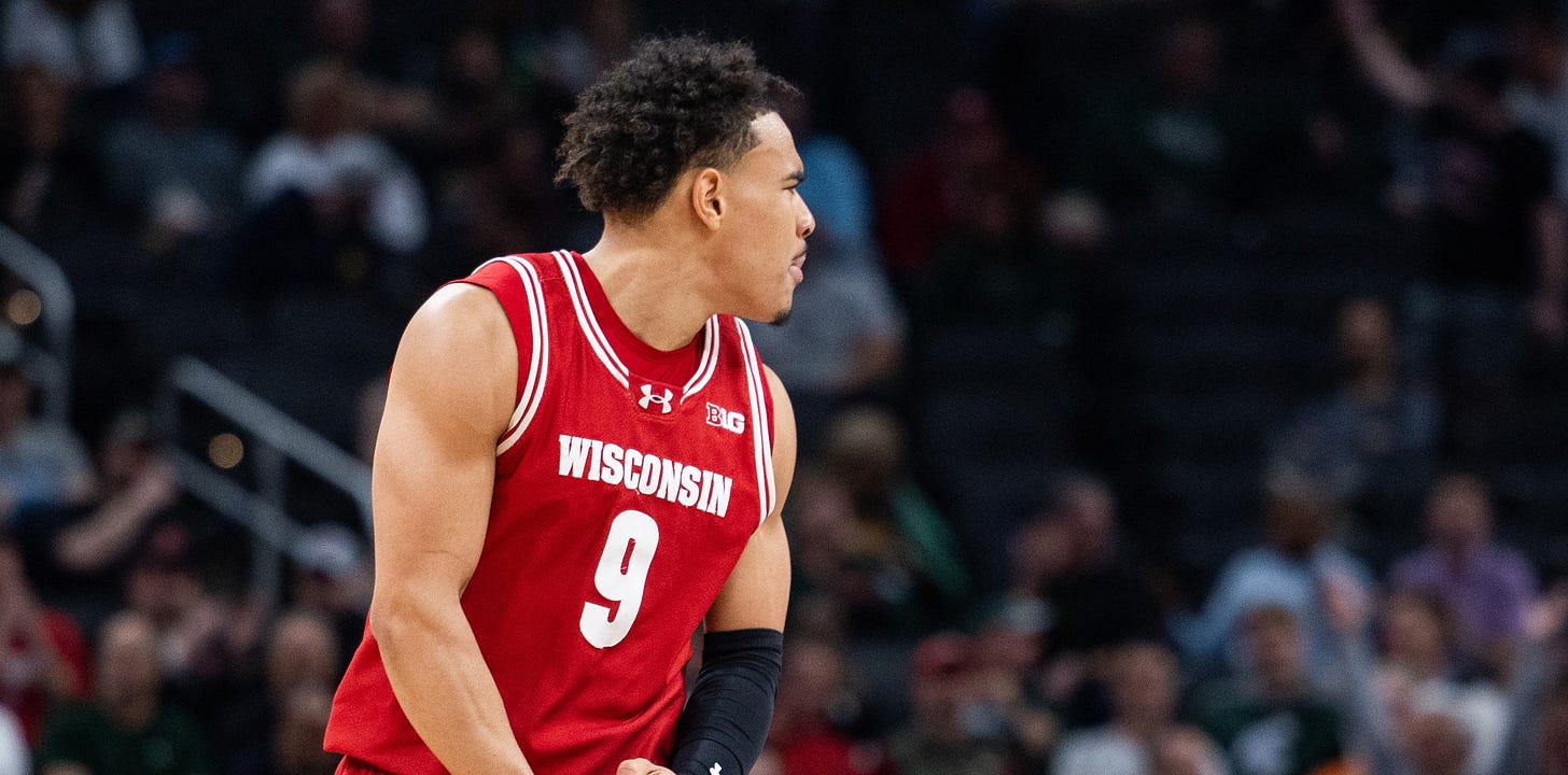 Wisconsin Badgers guard John Tonje (9) celebrates a made basket