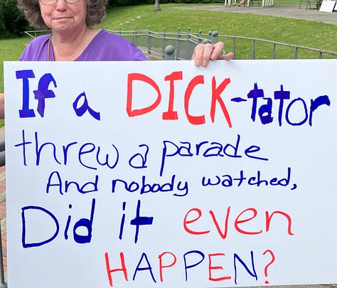 Signs at Bothell No Kings Rally