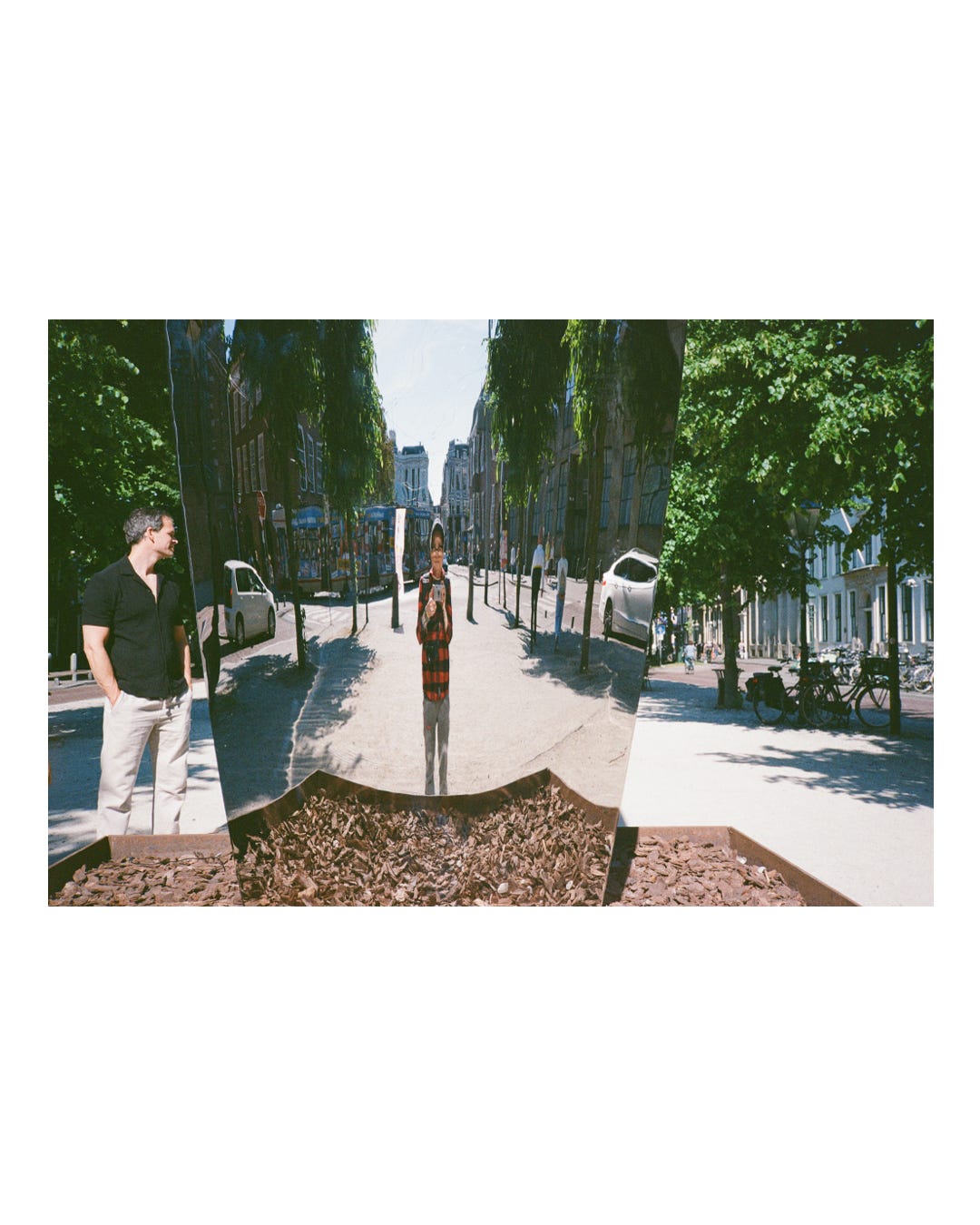A art piece mirror selfie I took with a film camera. A stranger is standing there looking at me.