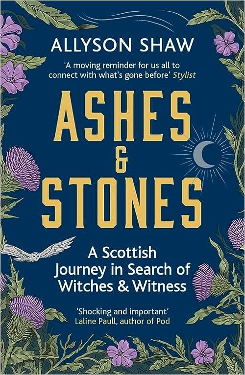 A blue book cover titled Ashes and Stones with a full moon and owl in flight, surrounded by thistles. 