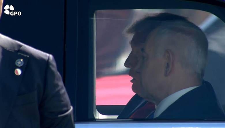 A person in a suit talking to another person

AI-generated content may be incorrect.