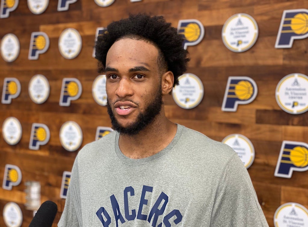 Oshae Brissett talks with reporters after practice.