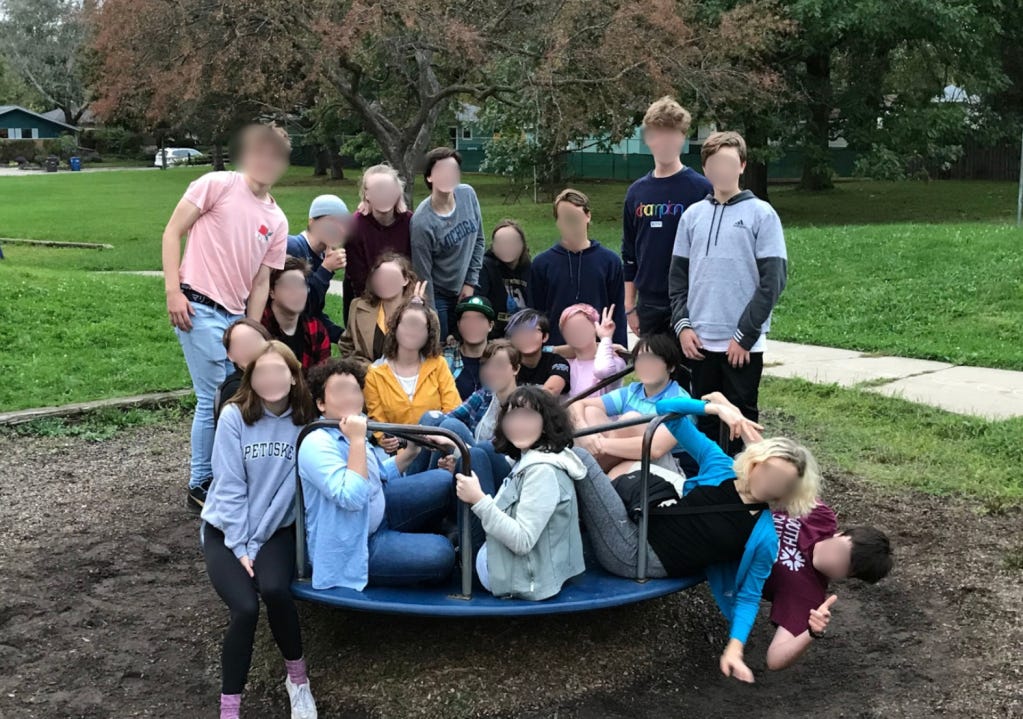 My entire class piled onto a Merry-Go-Round in 2019.