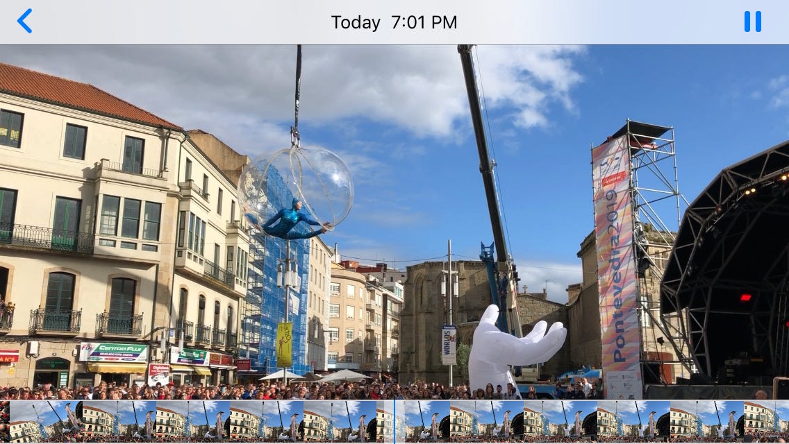 street performer in a split sphere over crowd street performer in a split sphere over crowd