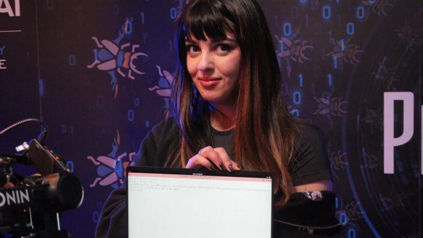 Chompie holding a laptop with her prize-winning hack Chompie holding a laptop with her prize-winning hack
