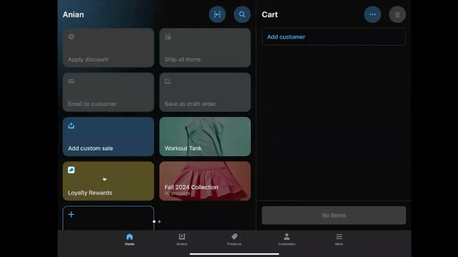 A screenshot of the Shopify POS interface labeled 'Anian,' showcasing a dark-themed layout with various options on the left and right panels. The left panel includes buttons for 'Apply discount,' 'Email to customer,' 'Add custom sale,' and 'Loyalty Rewards,' with icons and a '+ ' button. The right panel displays product tiles like 'Workout Tank' and 'Fall 2024 Collection' with images, alongside a 'Cart' section showing 'No items' and an 'Add customer' field. The bottom navigation bar features 'Home,' 'Orders,' 'Products,' 'Customers,' and 'More' icons. A screenshot of the Shopify POS interface labeled 'Anian,' showcasing a dark-themed layout with various options on the left and right panels. The left panel includes buttons for 'Apply discount,' 'Email to customer,' 'Add custom sale,' and 'Loyalty Rewards,' with icons and a '+ ' button. The right panel displays product tiles like 'Workout Tank' and 'Fall 2024 Collection' with images, alongside a 'Cart' section showing 'No items' and an 'Add customer' field. The bottom navigation bar features 'Home,' 'Orders,' 'Products,' 'Customers,' and 'More' icons.