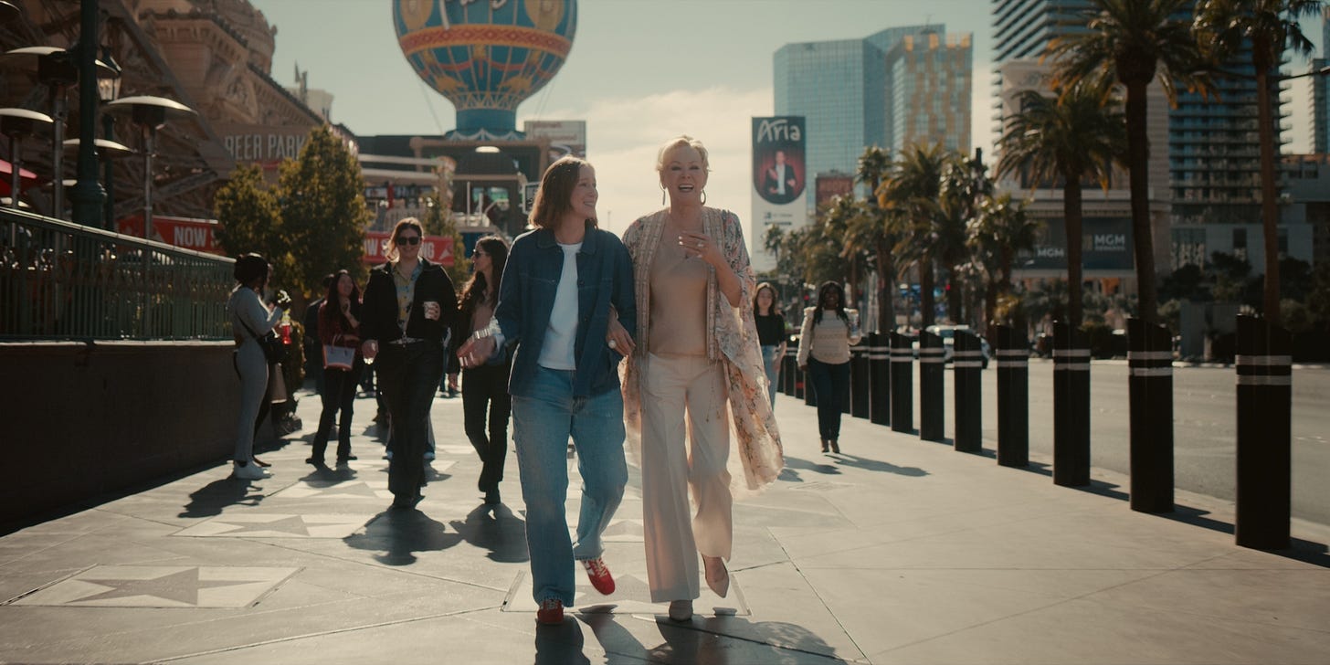 A still from the series finale of Hacks. Ava (Hannah Einbinder) and Deborah (Jean Smart) walk down a sidewalk in Las Vegas, smiling and laughing. A still from the series finale of Hacks. Ava (Hannah Einbinder) and Deborah (Jean Smart) walk down a sidewalk in Las Vegas, smiling and laughing.