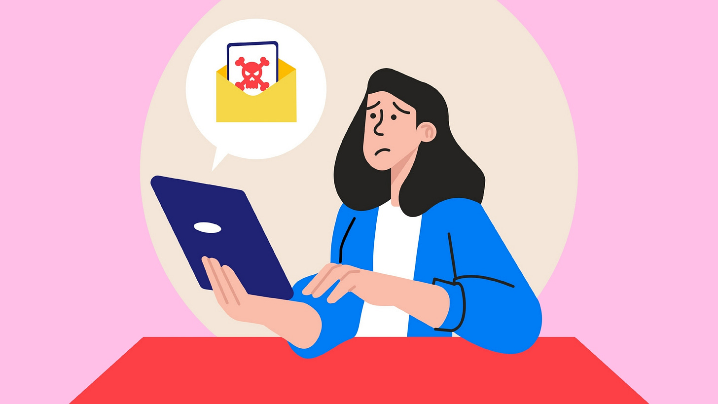 Illustration of a worried woman using a tablet, with a speech bubble showing an envelope containing a red skull and crossbones, symbolizing a suspicious or harmful email. The background is pink and beige, and the woman is seated at a red table wearing a blue jacket.