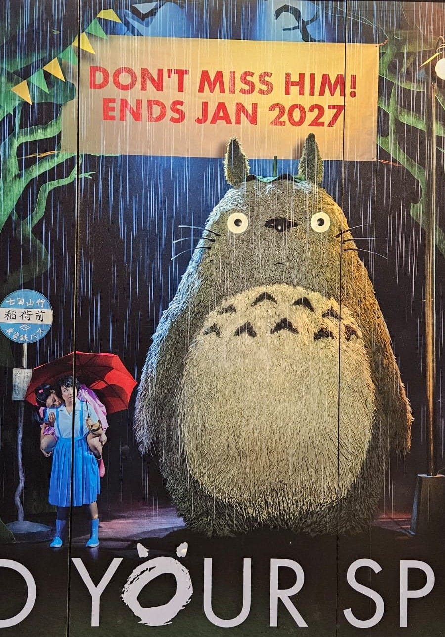 A photo of promotional for My Neighbor Totoro live theatre adaptation. It says "Don't miss him! Ends Jan 2027"