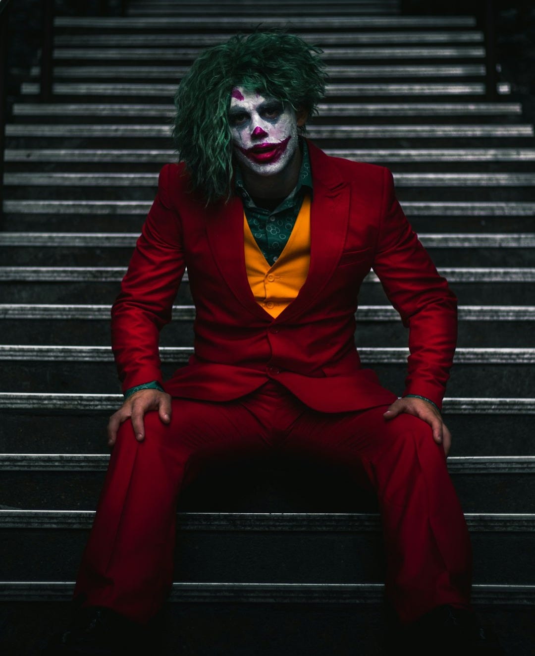 Joker sitting on stairs Joker sitting on stairs