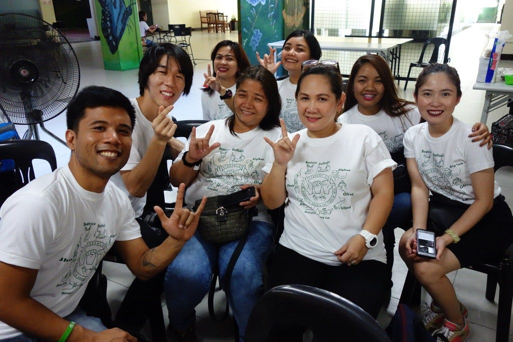 My FSL classmates, one of whom taught us Korean Sign Language as well. Being the artist in the group, I made our t-shirts.