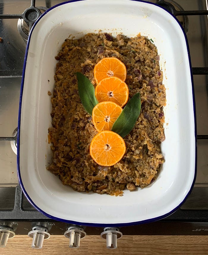 Vegan apple, red onion and chestnut stuffing: spoon the stuffing into a buttered tin Vegan apple, red onion and chestnut stuffing: spoon the stuffing into a buttered tin