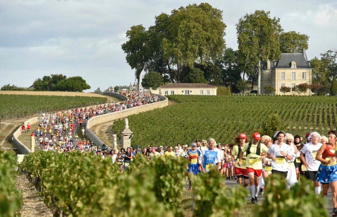 Château Lafite RothschilRunners pass by Château Lafite Rothschild, one of Bordeaux's most iconic estates, reflected in its pond as they make their way through the vineyards of Pauillac.d seen across its pond in Pauillac Château Lafite RothschilRunners pass by Château Lafite Rothschild, one of Bordeaux's most iconic estates, reflected in its pond as they make their way through the vineyards of Pauillac.d seen across its pond in Pauillac
