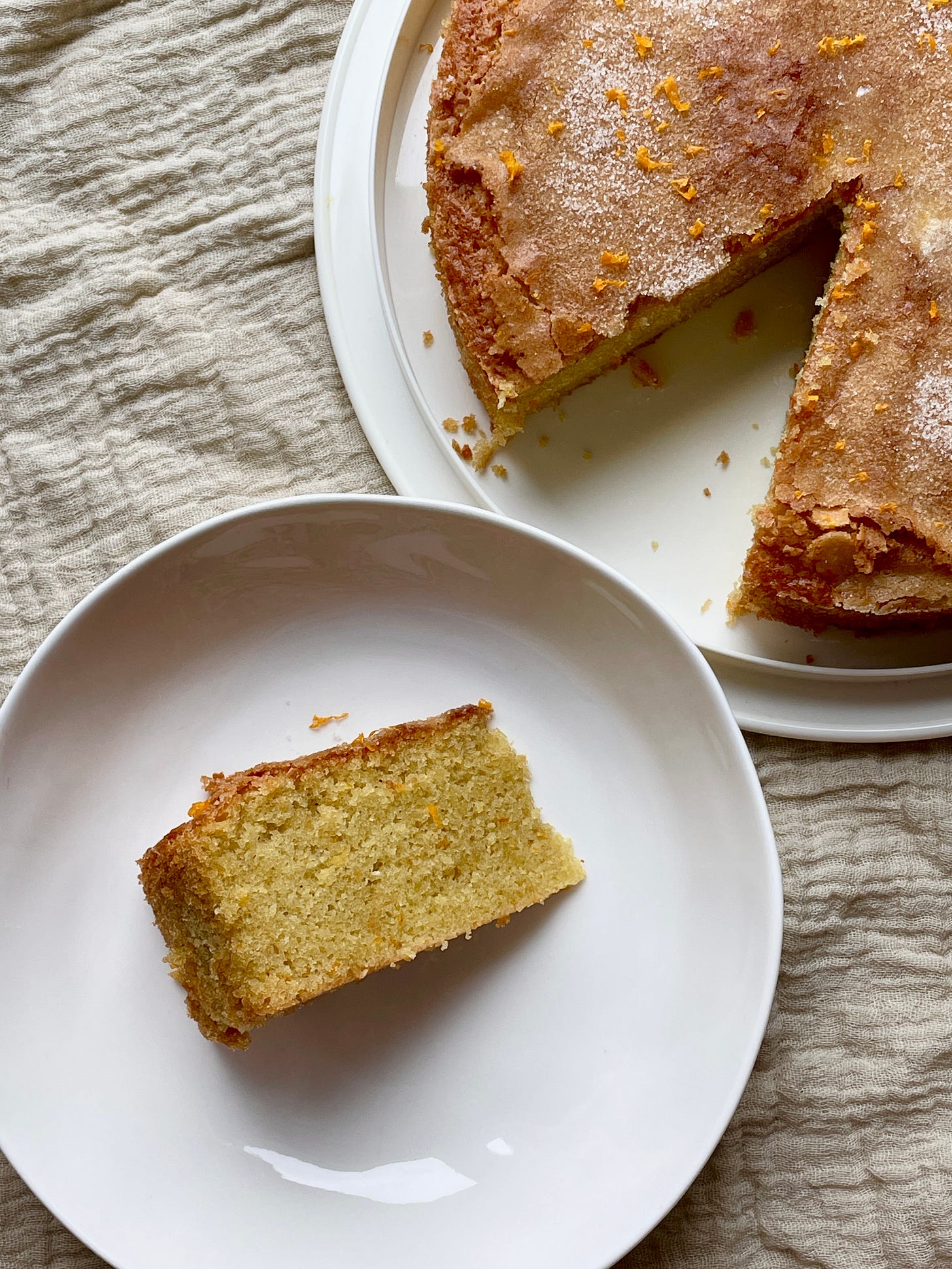 slice of orange olive oil cake from whole cake