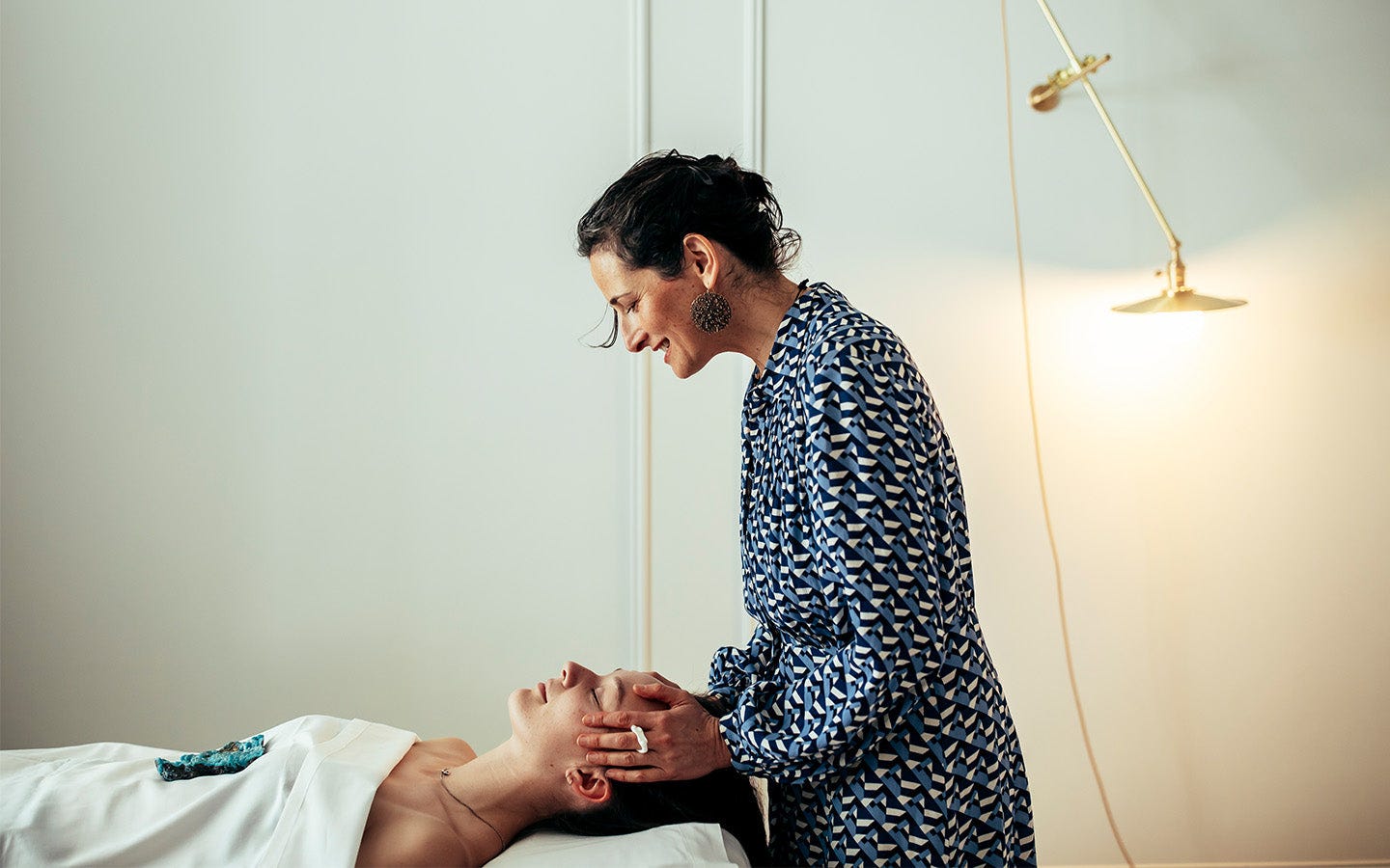 Client receiving an acupuncture and lymphatic treatment from Dr. Catherine Price in her Newport studio. Client receiving an acupuncture and lymphatic treatment from Dr. Catherine Price in her Newport studio.
