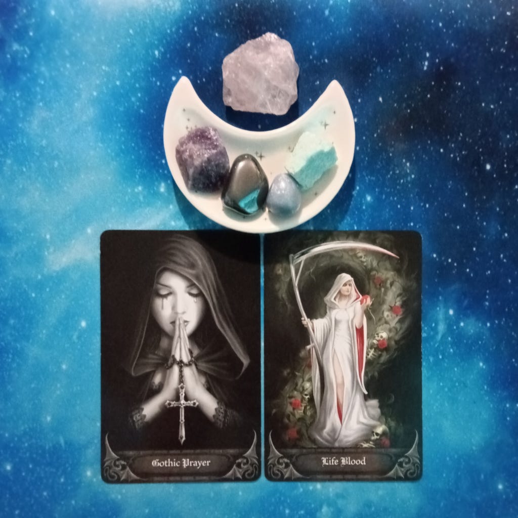 Your Difficulties Are Temporary ~ A Message From the Universe, 2 Anne Stokes Gothic Oracle cards and crystals on a starry blue background