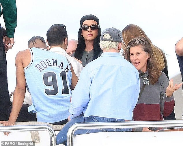 Katy Perry appeared downcast while partying on a boat in Perth on Tuesday as rumours ramp up that she has split with fiancé Orlando Bloom