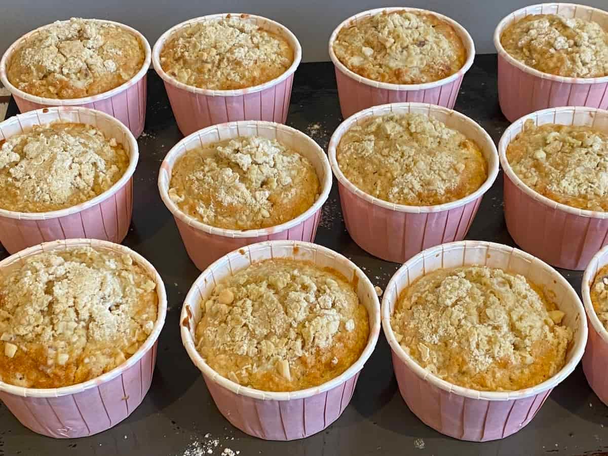 12 Apple, Oat and Cinnamon Muffins on a baking tray. 12 Apple, Oat and Cinnamon Muffins on a baking tray.