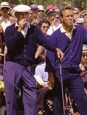 This may contain: two men in purple suits and white hats are holding golf clubs while an audience looks on This may contain: two men in purple suits and white hats are holding golf clubs while an audience looks on