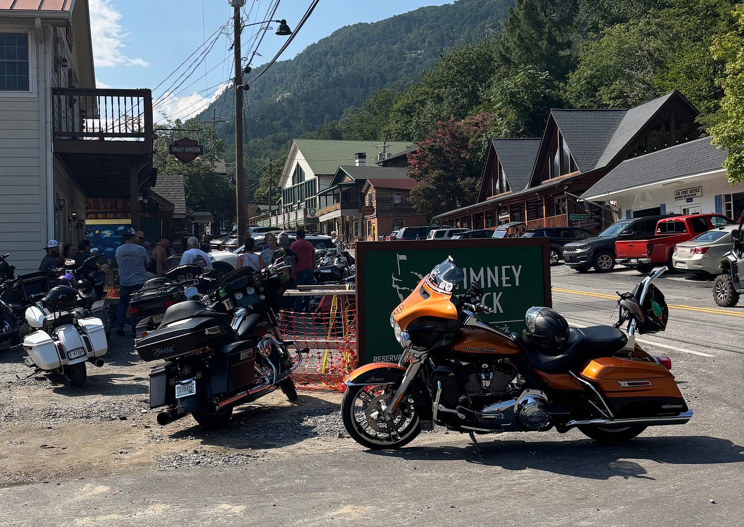 May be an image of 6 people, motorcycle, road and text
