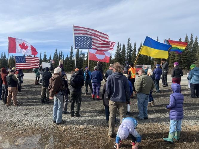 Colorful flags, penguins and protest signs fill Healy in 'Hands Off' rally  | Local News | newsminer.com