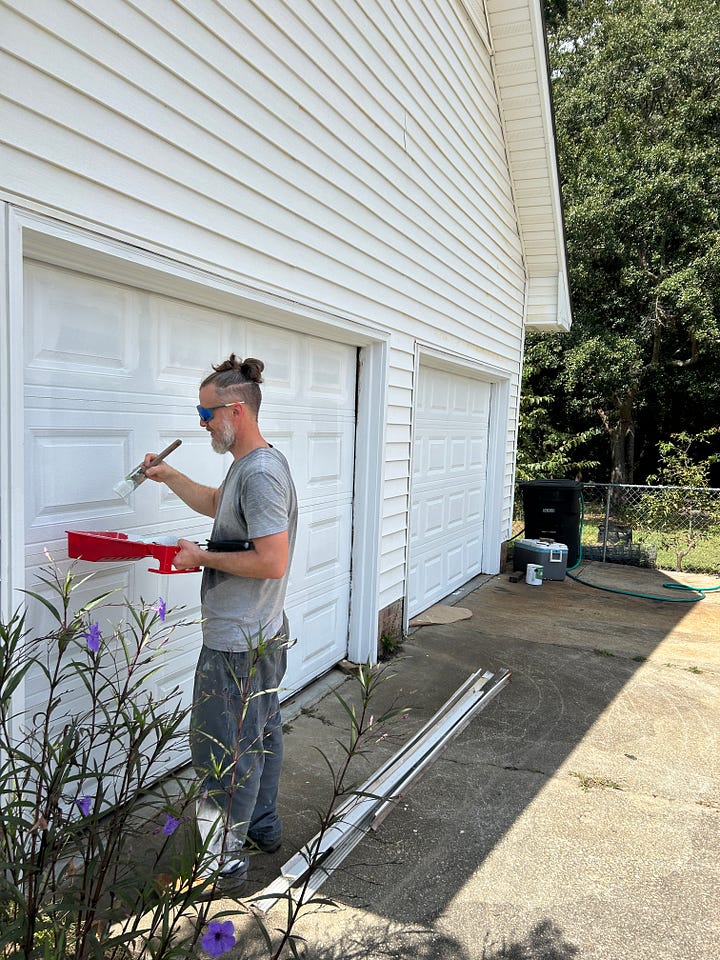 Lance Schultz painting garage doors