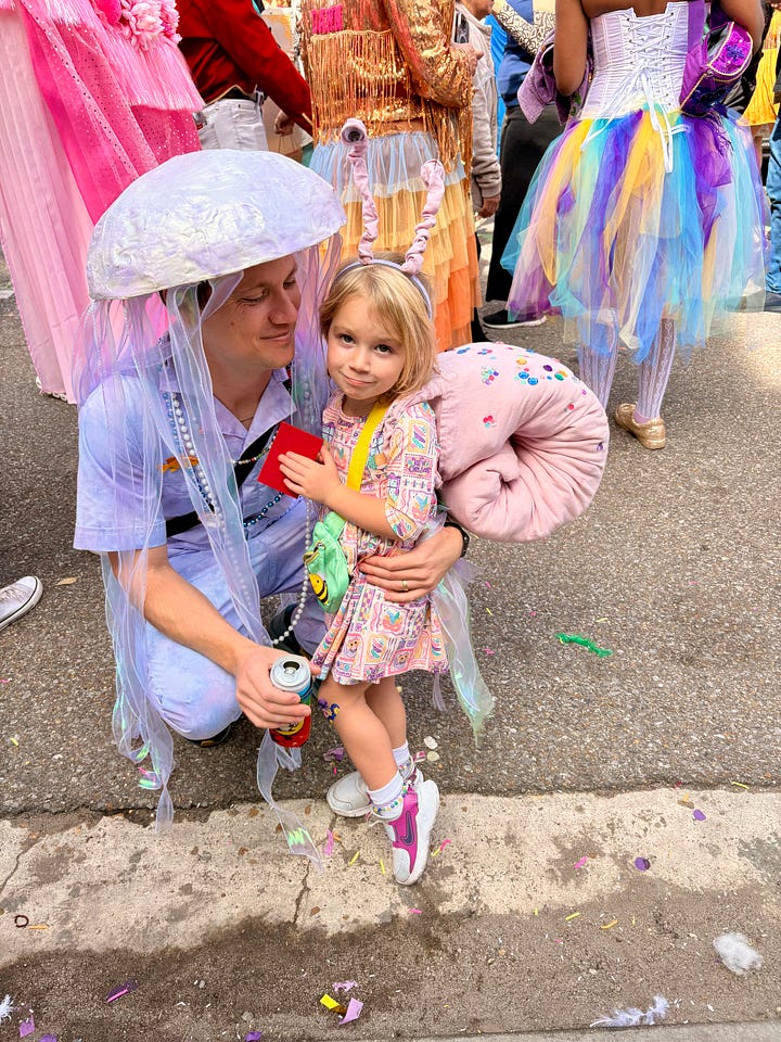 A photo of a man dressed as a jellyfish with a girl dressed as a snail; her “snail mail.”