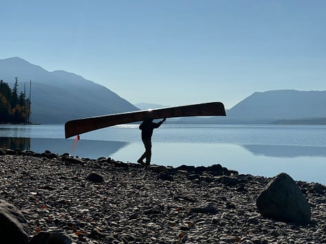 Images of Lake McDonald, left image of trees and mountains reflected on lake, middle computer with lake in background, right man carrying canoe to lake