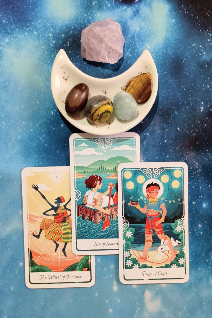 New Timelines, Reframing Anxiety & Excitement: A Message From the Universe, 3 Tarot of the Divine cards and crystals on a starry blue background New Timelines, Reframing Anxiety & Excitement: A Message From the Universe, 3 Tarot of the Divine cards and crystals on a starry blue background