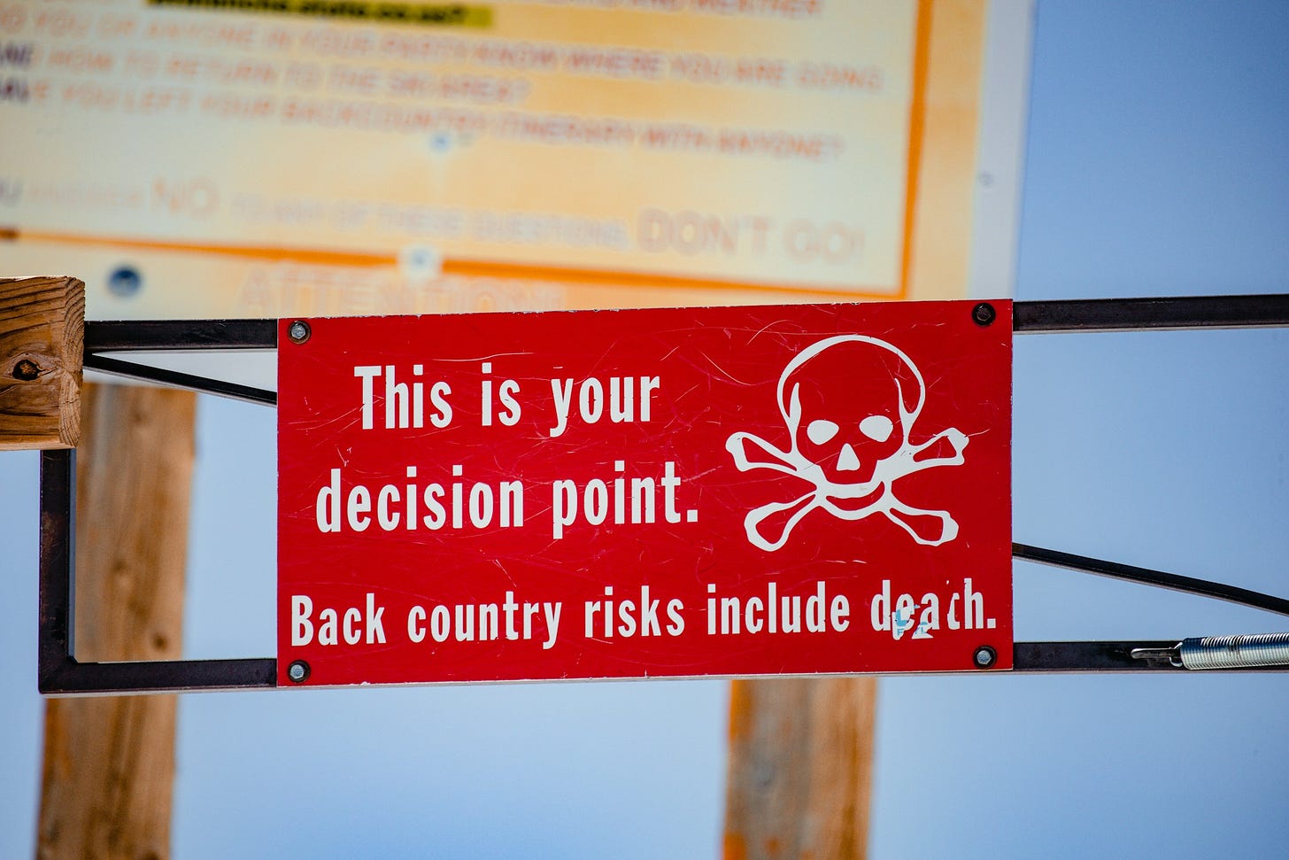 Sign reading "This is your decision point. Backcountry risks include death.
