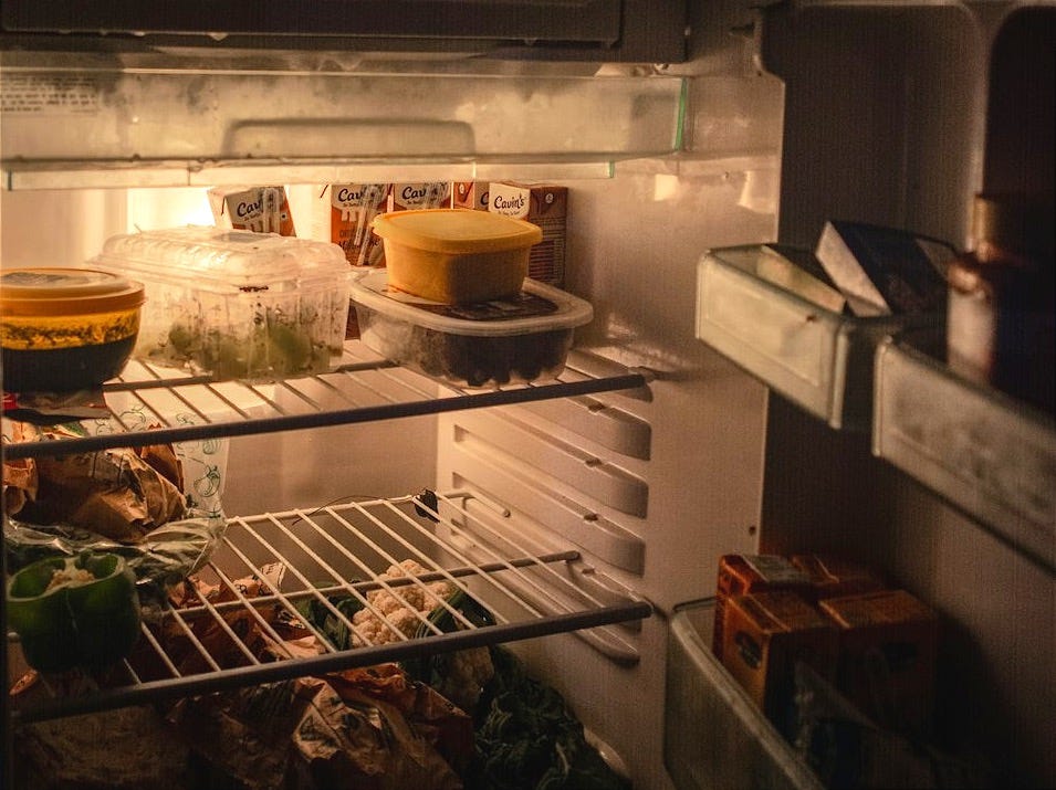 white refrigerator with food inside