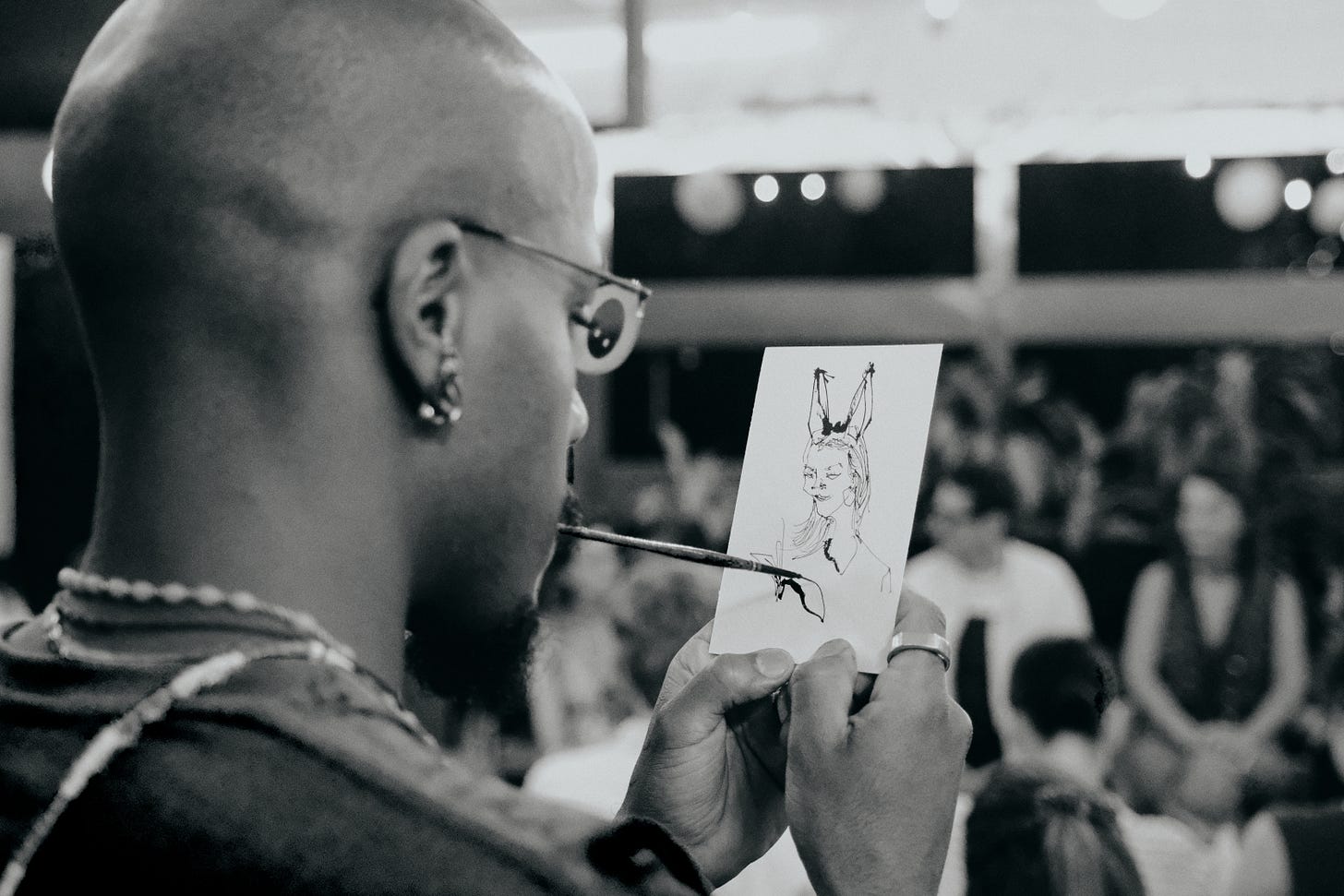 Dig paints a dreamer’s portrait with a sumi brush held in his mouth during Dreams & Obstacles NYC 1.