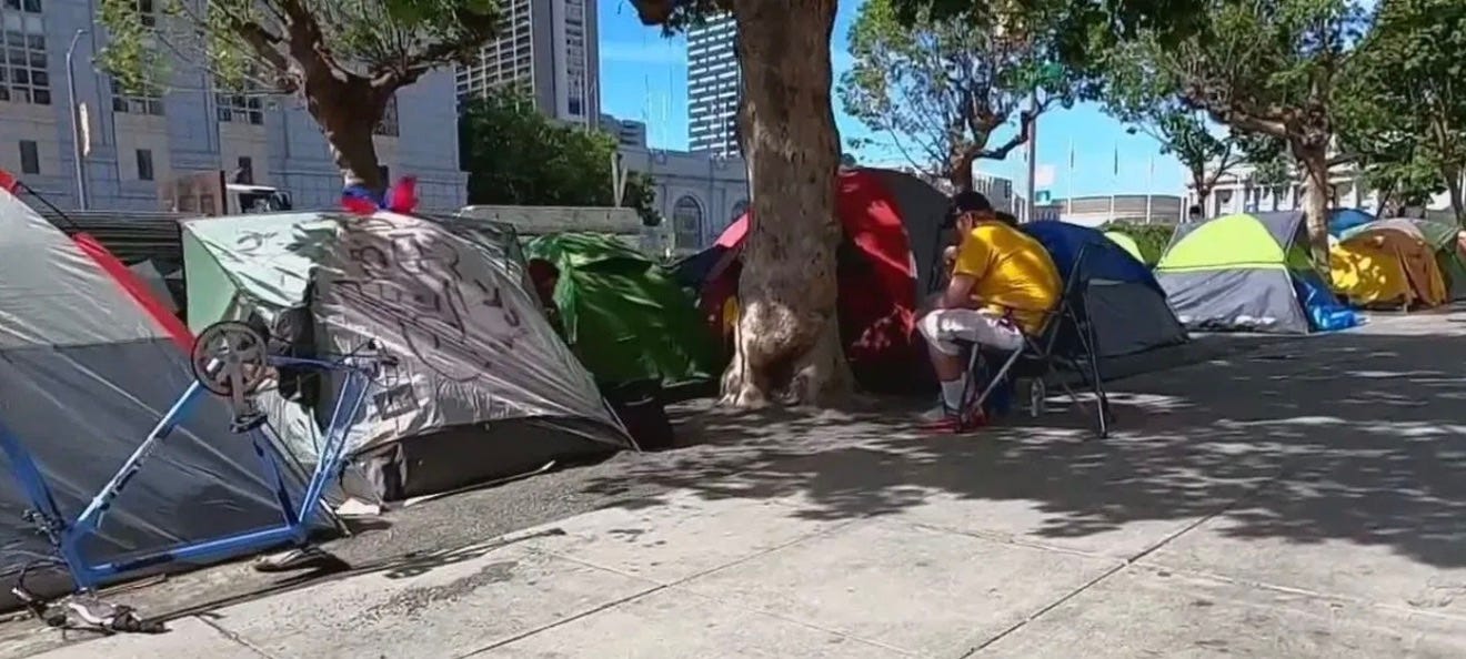 A group of tents on the sidewalk

AI-generated content may be incorrect.