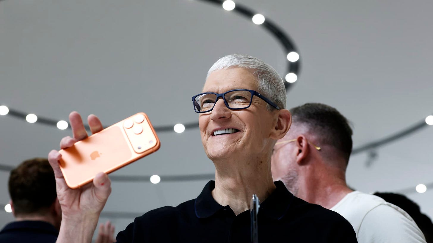CUPERTINO, CALIFORNIA - SEPTEMBER 09: Apple CEO Tim Cook holds a next generation iPhone 17 during an Apple special event at Apple headquarters on September 09, 2025 in Cupertino, California. Apple unveiled a new generation of iPhones and updated Apple Watches and AirPods during a special event at Apple headquarters. (Photo by Justin Sullivan/Getty Images)