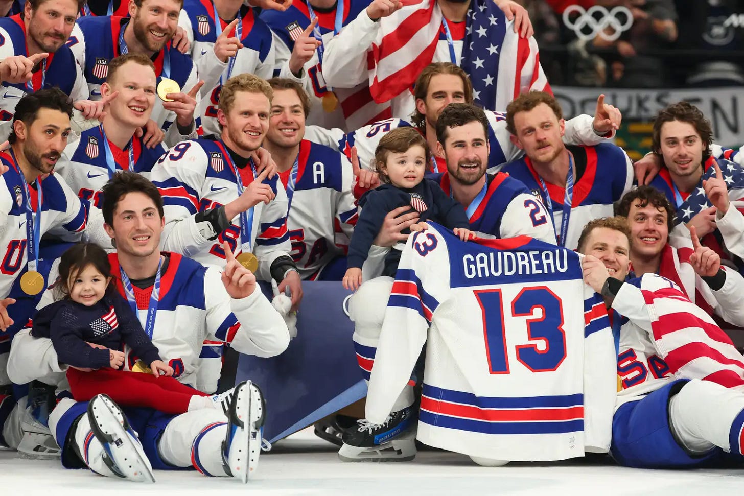 Players of Team United States pose for photographs during the medal ceremony following the Men's Gold Medal match between Canada and the United States on day 16 of the Milano Cortina 2026 Winter Olympic games at Milano Santagiulia Ice Hockey Arena on February 22, 2026 in Milan, Italy. (Photo by Gregory Shamus/Getty Images)