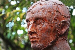 corroding metal statue