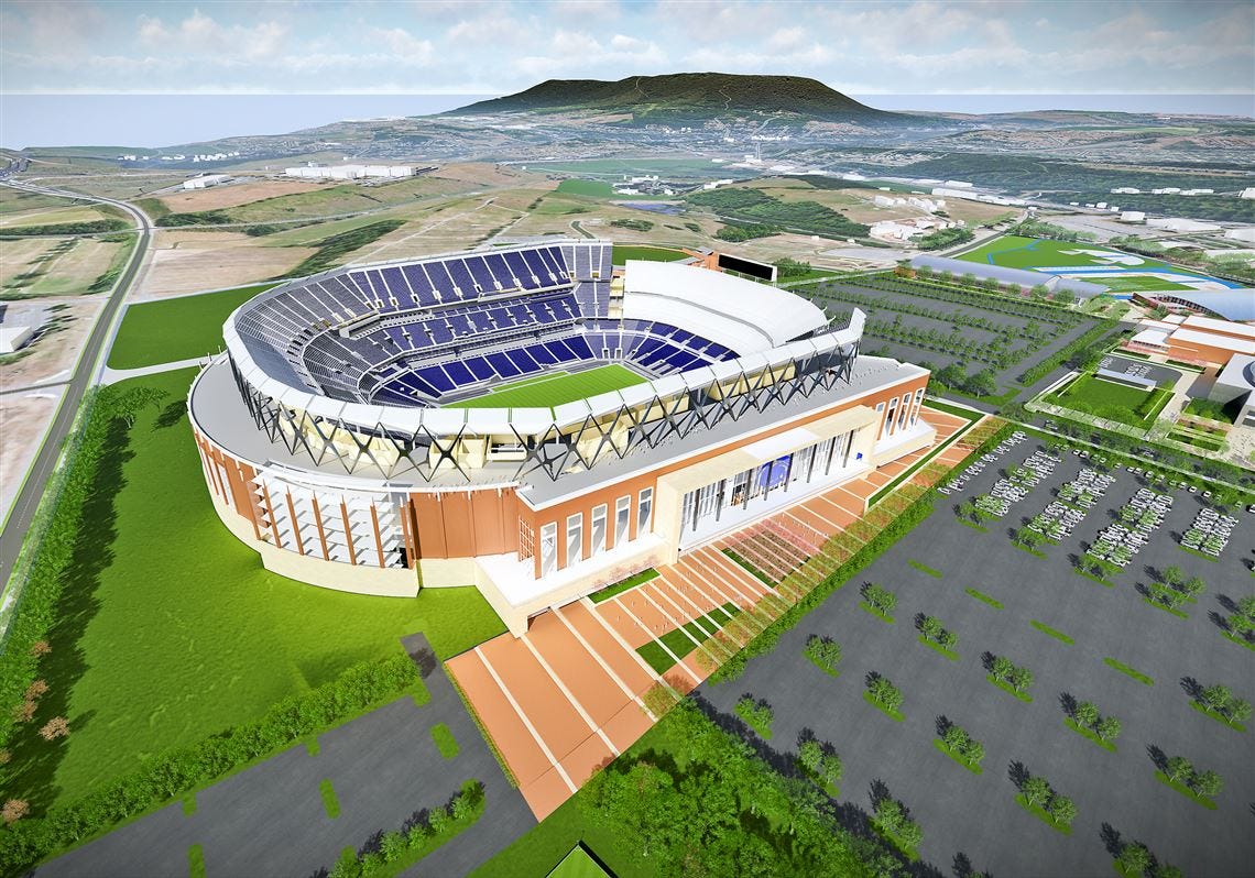stadium in front of a mountain