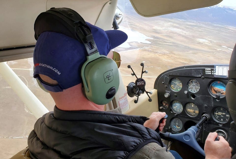 Sam Rogers flying small plane Sam Rogers flying small plane
