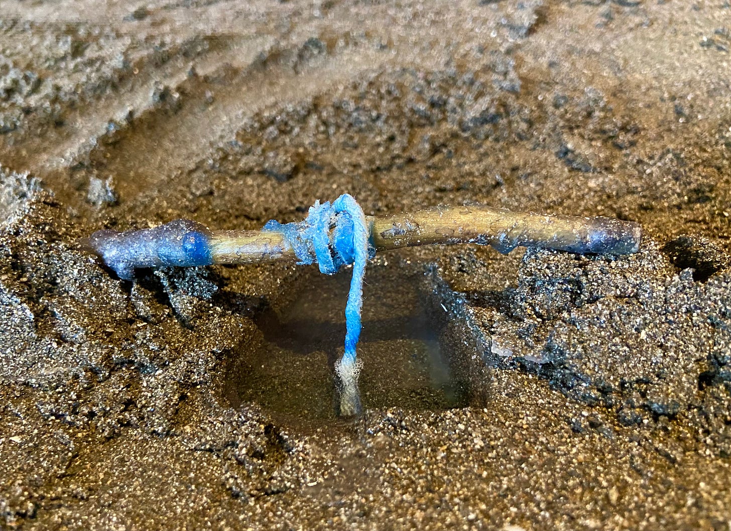 candle in sand