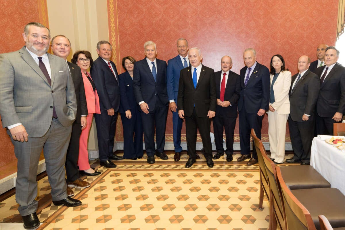 Senators take part in a photo op with Israeli Prime Minister Benjamin Netanyahu.