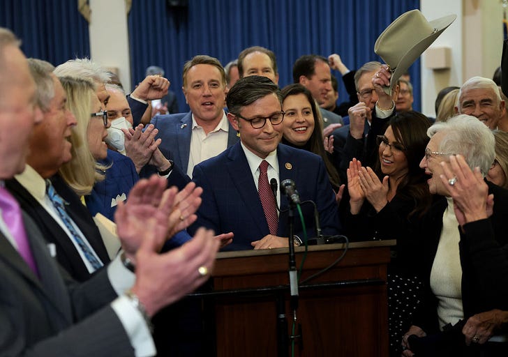 Congressman Mike Johnson (R-LA) surrounded by House Republicans speaks after he was elected as the speaker nominee (Photo by Win McNamee/Getty Images)