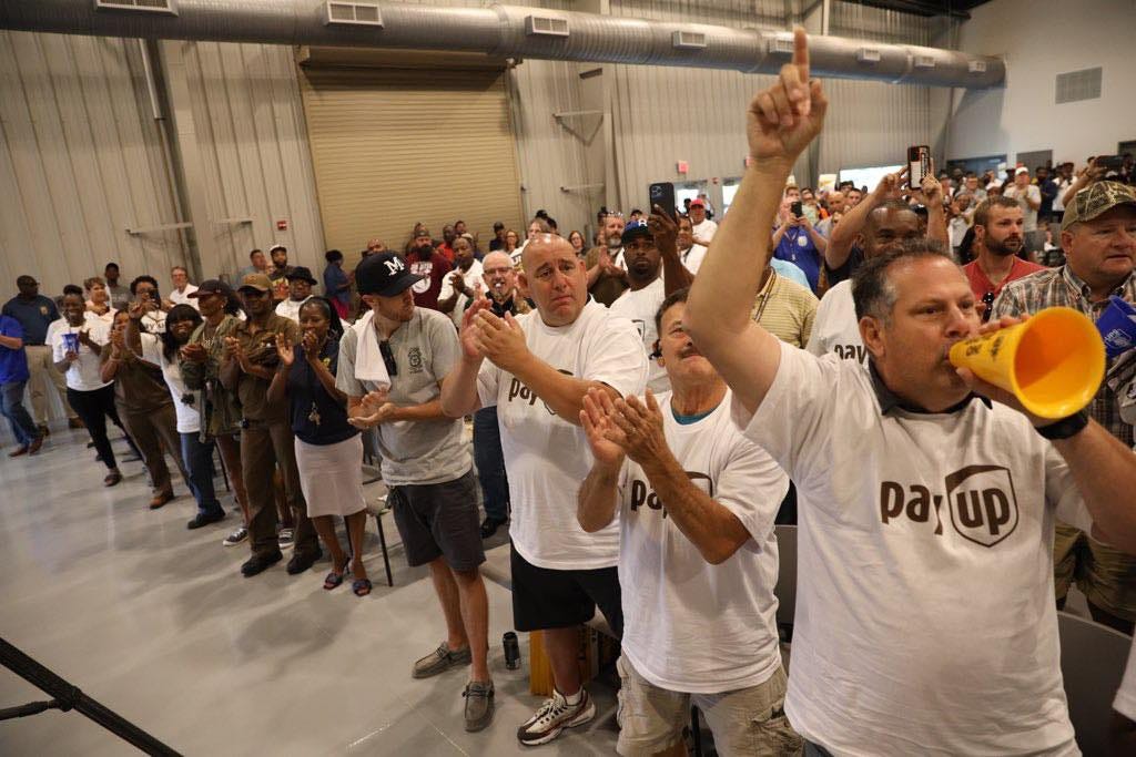 May be an image of 1 person, trumpet, crowd and text