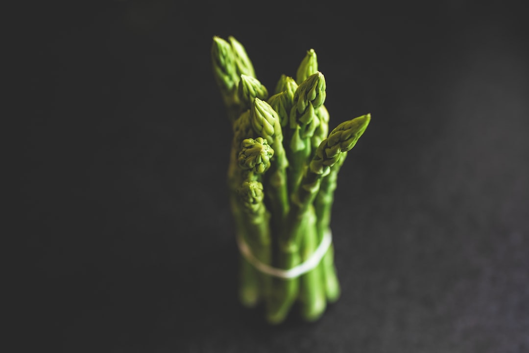 green vegetable on black textile