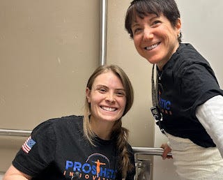 A female prosthetist-to-be, with me, smiling hugely after casting.