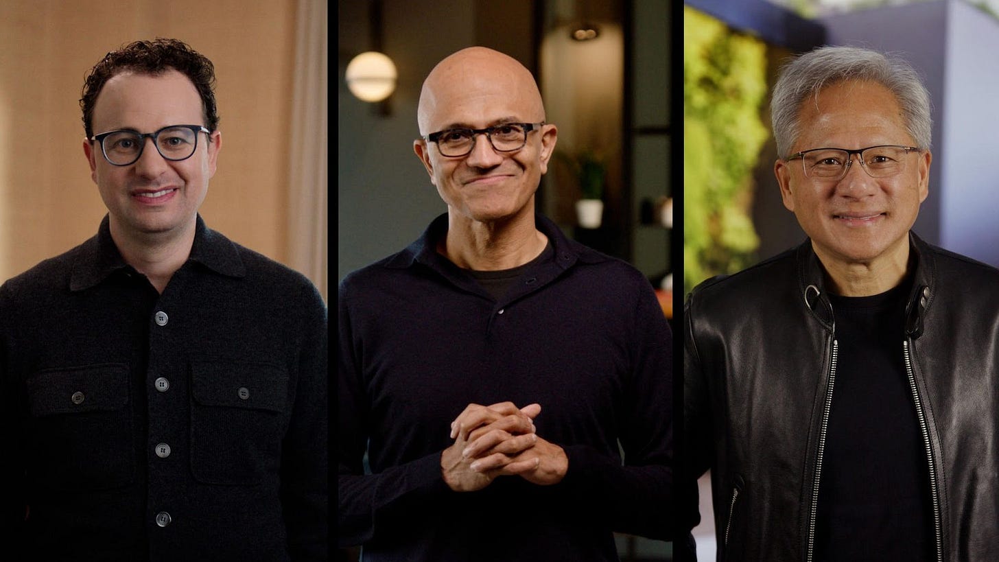 Photo of Dario Amodei, Satya Nadella and Jensen Huang