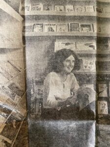 Barbara sitting in her bookstore