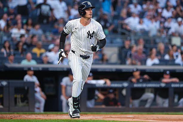 Cody Bellinger of the New York Yankees hits a solo home run int he first inning during the game between the Minnesota Twins and the New York Yankees...